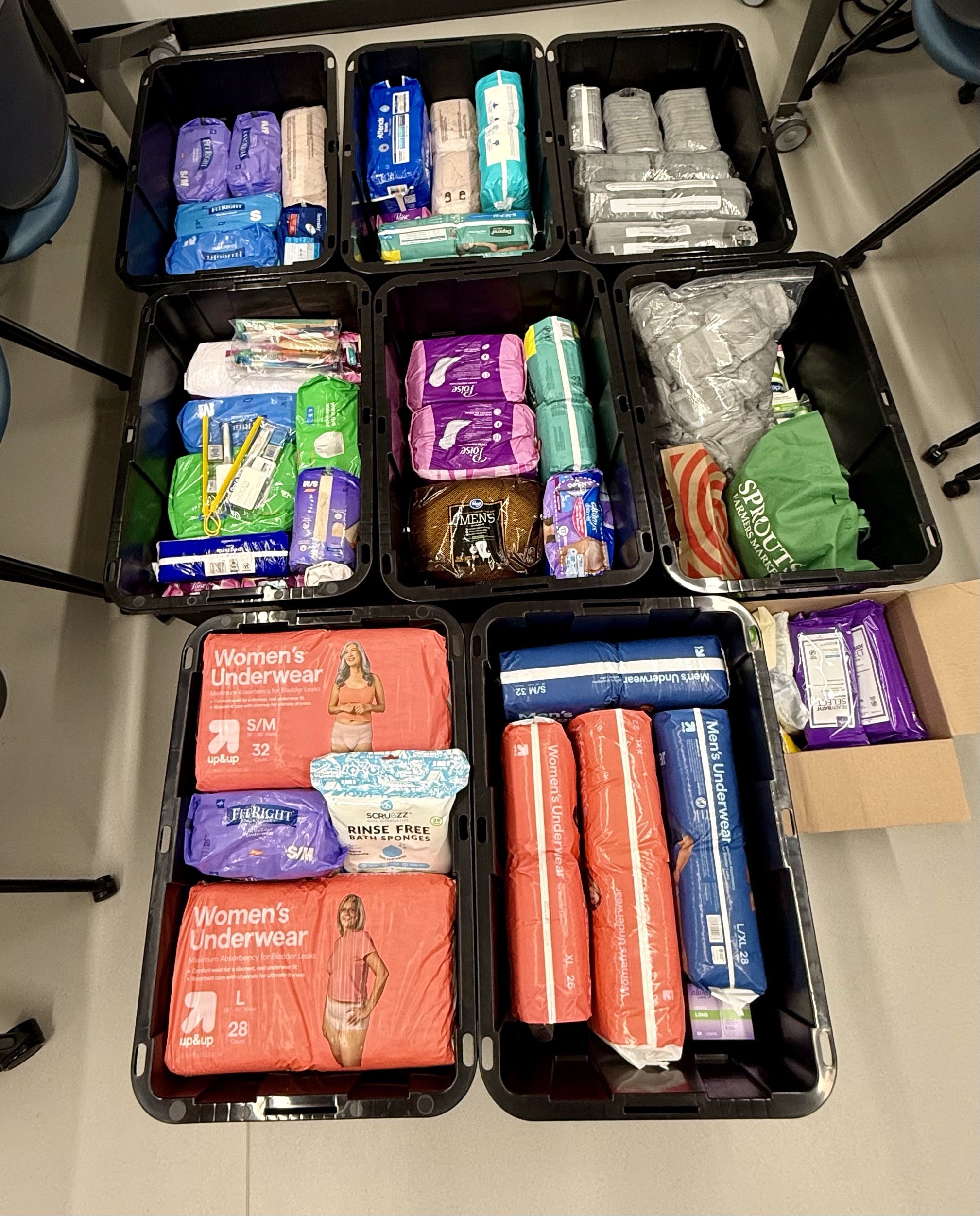 Storage totes filled with donated items from an incontinence drive