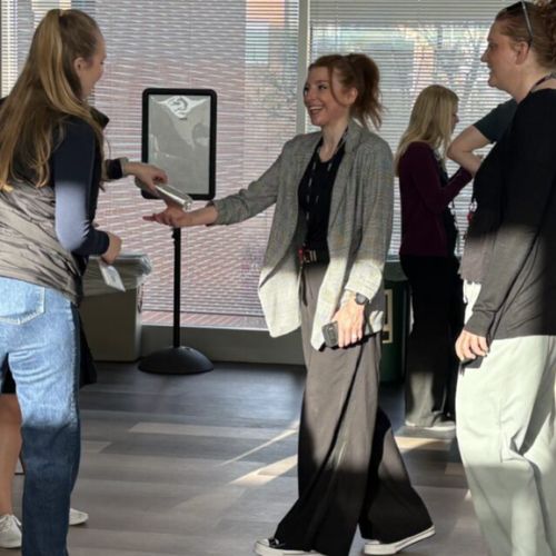 A happy staff member receives a free burrito during Professional Staff Appreciation Day 2026, hosted by Staff Council.